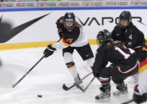 MALMO, SWEDEN - APRIL 3:  Germany's Laura Kluge #25 battles for a loose puck with Japan's Yurie Adachi #11 and Ayaka Toko #4 during relegation round action at the 2015 IIHF Ice Hockey Women's World Championship. (Photo by Francois Laplante/HHOF-IIHF Images)

